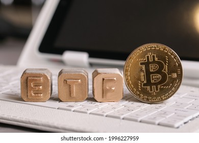 Letters Gold ETF And Bitcoin On White Keyboard