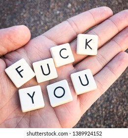 Letters in hand studio light