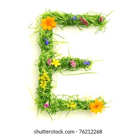 Letters made of flowers and grass isolated on white