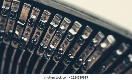 Letters and numbers on typo keys of an old manual typewriter on a retro writing machine, close up view - Shutterstock ID 2224519919