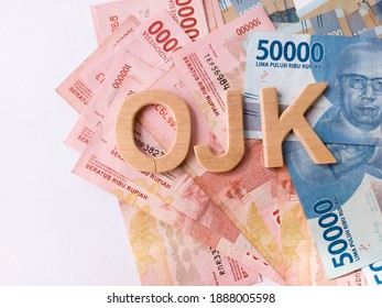 The Letters OJK (Indonesian Financial Authority) With A Background In Indonesian Currency, Indonesian Aceh