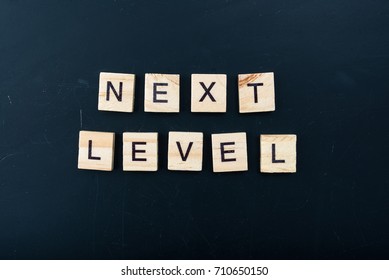 The letters on the black background form the text "next level" - Shutterstock ID 710650150