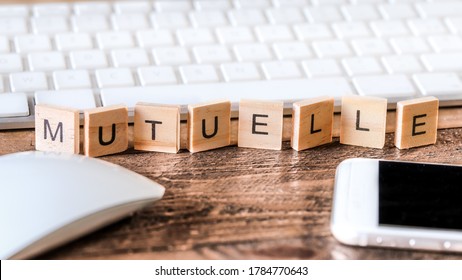 Letters on wooden pieces concept
french word means mutual health
business background - Shutterstock ID 1784770643