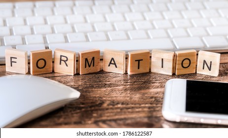Letters on wooden pieces concept, business background with the french word "formation" means training