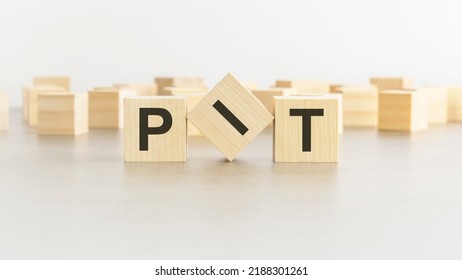 Letters PIT On Wooden Blocks, White Background