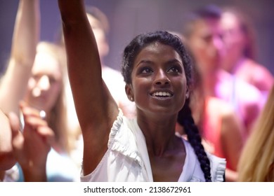 Letting Loose At The Club. A Pretty Young Woman Partying It Up With Friends In The Club.