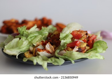 Lettuce Chicken Wrap. Tandoori Chicken Bites, Sauteed Baby Corn, Fresh Cut Tomatoes And Onions Tossed And Wrapped In Iceberg Lettuce Leaves. Shot On White Background