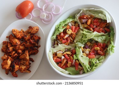 Lettuce Chicken Wrap. Tandoori Chicken Bites, Sauteed Baby Corn, Fresh Cut Tomatoes And Onions Tossed And Wrapped In Iceberg Lettuce Leaves. Shot On White Background