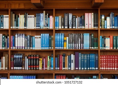 LEUVEN, BELGIUM - SEPTEMBER 05, 2014: Wooden bookshelves in the historical library of the Catholic University in Leuven. The library is National treasure of Belgium since 1987.