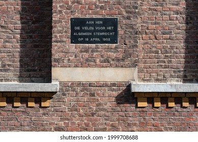 Leuven, Flemish Brabant - Belgium - 06 20 2021: Inscription On A Brick Stone Wall About The Introduction Of The Sacrifices For The Universal Suffrage In 1902