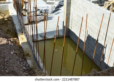 Leuven, Flemish-Brabant, Belgium - October 08, 2022: Follow Up Apartment Project. Basement Filled With Raining Water Under A Sunny October Saturday