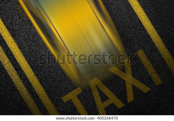 Level asphalted road with a dividing yellow stripes\
and moving with at high speed the vehicle cab. The texture of the\
tarmac, top view.