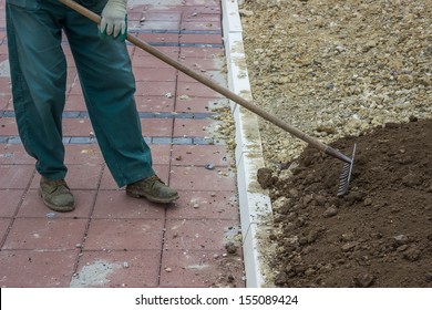 Leveling Work, Soil and Site Preparation for Lawns.  Level the soil and clear out stones and debris