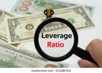 Leverage Ratio.Magnifying Glass Showing The Words.Background Of Banknotes And Coins.basic Concepts Of Finance.Business Theme.Financial Terms.