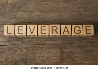 Leverage word on wooden cubes - Shutterstock ID 450707140