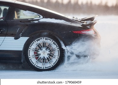 LEVI, FINLAND - FEB 20: Rear Wheel Spin Of A PORSCHE 911 TURBO Car During Porsche Driving Experience Snow & Ice Press Event On February 20, 2014 In LEVI, FINLAND