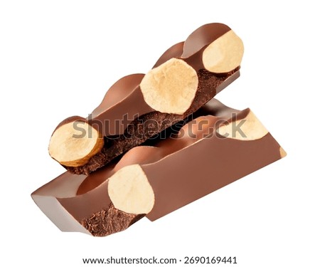 Levitating Broken Chocolate bar  with  hazelnuts isolated on white background. Flying  chocolate pieces. Explotion. Pattern