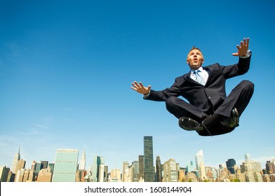 Levitating Businessman Holding His Arms Out Stock Photo 1608144904 ...