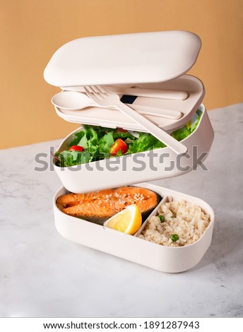 Levitation food, food in lunch box, open lunchbox. Healthy meal concept. Home made lunch