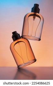 Levitation of set of perfume bottles on a gradient background