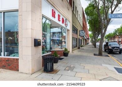 LEXINGTON, NC, USA-8 MAY 2022:  View Of Sidewalk And Shops From Second St. Down Main St. In Late Spring.