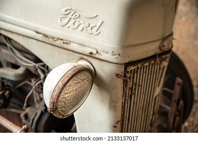 LEXINGTON, UNITED STATES - Jun 21, 2016: A Closeup Of A Car Headlight Detail Of Old Ford Tractor On Farm