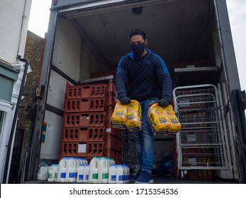 Leyton. London. UK.  April The 27th, 2020. 7am.Delivery Man Preparing Goods While Delivering Early In The Morning During The Lockdown.