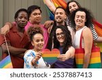 LGBT community multiethnic people enjoys a meet up looking at camera together and capturing the moment.