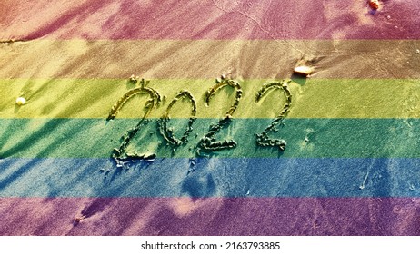 LGBT Concept Happy New Pride Month 2022 , Rainbow Color Texture Background With LGBT Pride Flag Or Rainbow Pride Flag Pattern On The Beach