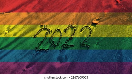 LGBT Concept Happy New Pride Month 2022 , Rainbow Color Texture Background With LGBT Pride Flag Or Rainbow Pride Flag Pattern On The Beach