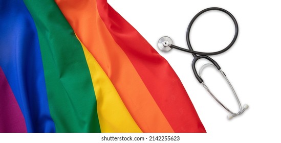 LGBT Health Care. Medical Stethoscope On Rainbow Pride Flag, White Background, Top View. Transgender And Gay Health Treatment And Rights, Copy Space