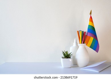 LGBT Office, Desk With Rainbow Flag And Stationery, Blank Wall With Space For Text