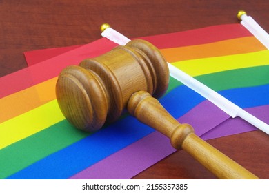 LGBT Rights And Laws Concept. Wooden Judge Gavel On LGBT Flags.