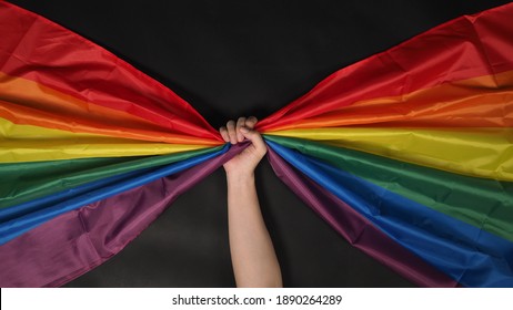 LGBTQ Flag Or Lesbian Gay Bi Sexsual Transgender Queer Or Homosexsual Pride Rainbow Flag On Black Background. Represent Hand Symbol Of Freedom, Peace, Equality And Love. LGBTQ Concept