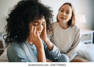 Lgbtq, woman and depression for couple fight in bedroom of home with conflict, crisis or problem relationship. Lesbian, partner and girl on bed with stress, anxiety and sad for argument and divorce - Powered by Shutterstock