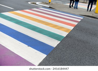 LGBTQIA+ pedestrial crossing in rainbow colours, selective focus
