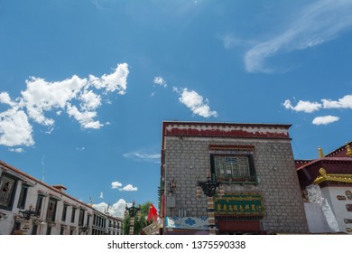 Lhasa, Tibet - 22 JUN 2018: Architecture Of Buildings In Pargor Subdistrict Located In Lhasa, Tibet. Background With Sunny Blue Sky And Clouds.