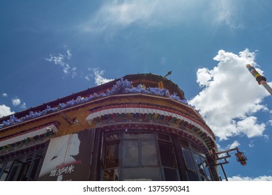 Lhasa, Tibet - 22 JUN 2018: Architecture Of Buildings In Pargor Subdistrict Located In Lhasa, Tibet. Background With Sunny Blue Sky And Clouds.