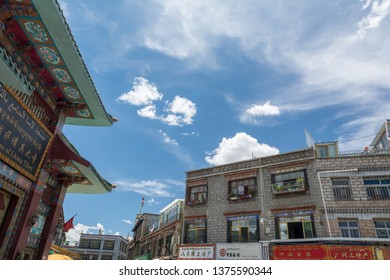 Lhasa, Tibet - 22 JUN 2018: Architecture Of Buildings In Pargor Subdistrict Located In Lhasa, Tibet. Background With Sunny Blue Sky And Clouds.