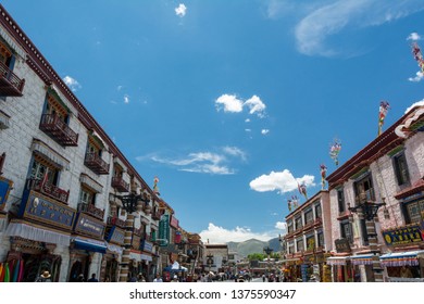 Lhasa, Tibet - 22 JUN 2018: Architecture Of Buildings In Pargor Subdistrict Located In Lhasa, Tibet. Background With Sunny Blue Sky And Clouds.