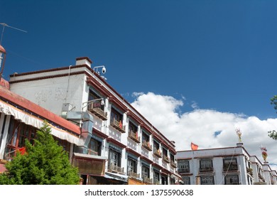 Lhasa, Tibet - 22 JUN 2018: Architecture Of Buildings In Pargor Subdistrict Located In Lhasa, Tibet. Background With Sunny Blue Sky And Clouds.