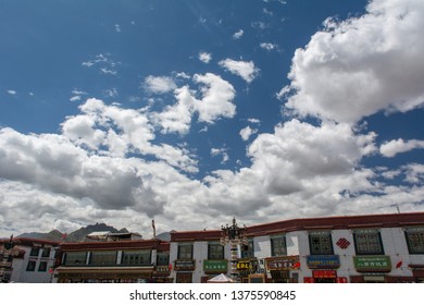 Lhasa, Tibet - 22 JUN 2018: Architecture Of Buildings In Pargor Subdistrict Located In Lhasa, Tibet. Background With Sunny Blue Sky And Clouds.