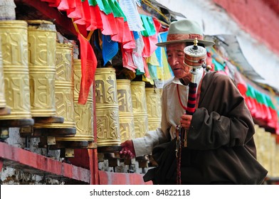 LHASA, TIBET - AUGUST 8: Unidentified Tibetan pilgrim circles the Potala palace on August 8, 2010 in Lhasa, Tibet. Devotees walk 108 times around the Potala for good luck.