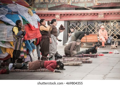 LHASA, TIBET  MAY 2016 Tibetans perform prostration in front of Jokhang temple as a part of pilgrimage in Lhasa, Tibet where they celebrate Sagadawa festival in May.
