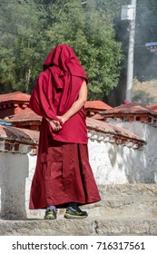 LHASA, TIBET - May 31,2016: A Buddhist Monk Walking Away From The Camera At The Sera Monastery Near Lhasa Tibet