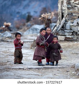 LHO - NOVEMBER 29: Tibetan Boy Lapsang, Age 6, Tenzing, Age 7, Karma, Age 7, Dawa, 5, Poses For A Photo During Local Full Moon Festival On November 29, 2009 In Lho Village, Gorkha District, Nepal