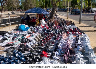 L'Hospitalet, Spain - September 08, 2019: Illegal Market Of Fake Sport Shoes, Counterfeit In The Street Called Top Manta