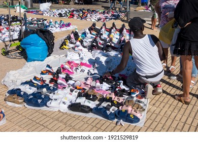 L'Hospitalet, Spain - September 08, 2019: Illegal Market Of Fake Sport Shoes, Counterfeit In The Street Called Top Manta