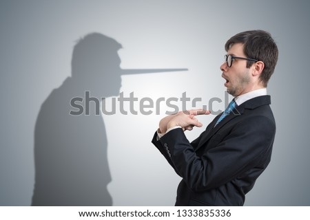 Liar has shadow with long nose. Conscience concept.