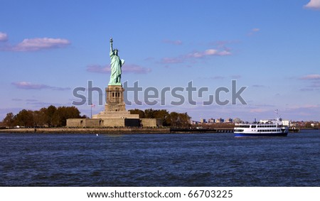 Liberate statue  view from the sea with a boat